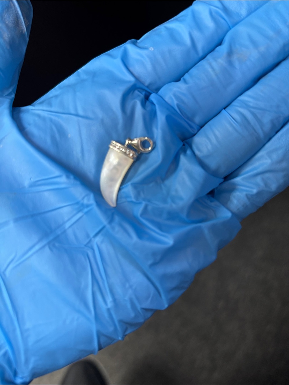 This is a Thomas Sabo white mother-of-pearl tooth charm 925